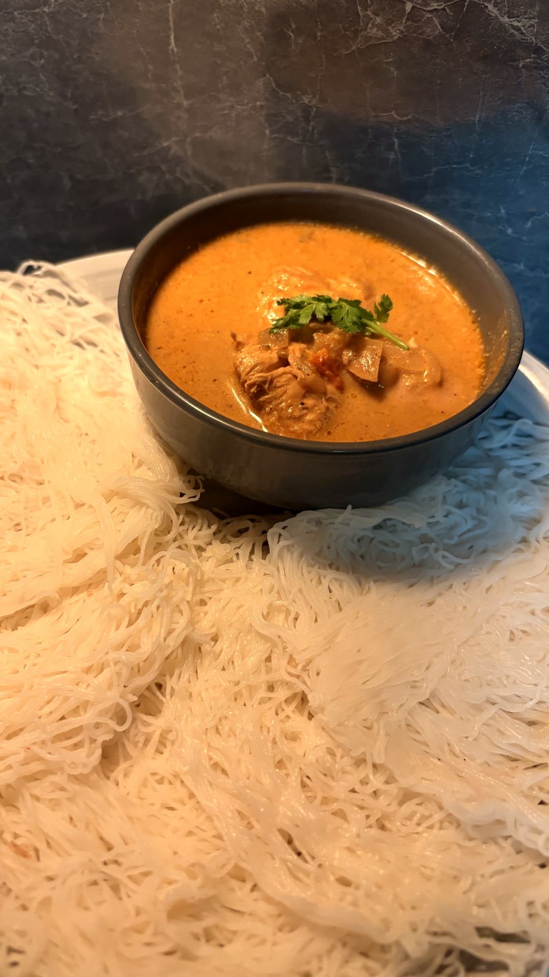 Idiyappam with coconut chicken curry